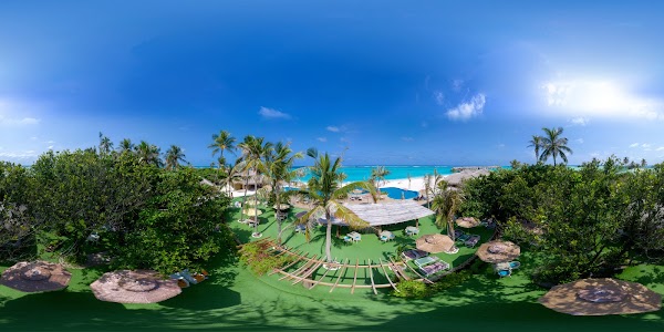Aerial 360 panorama of You & Me Maldives showing lawns, palm trees, thatched parasols, pool, white sand beach and turquoise