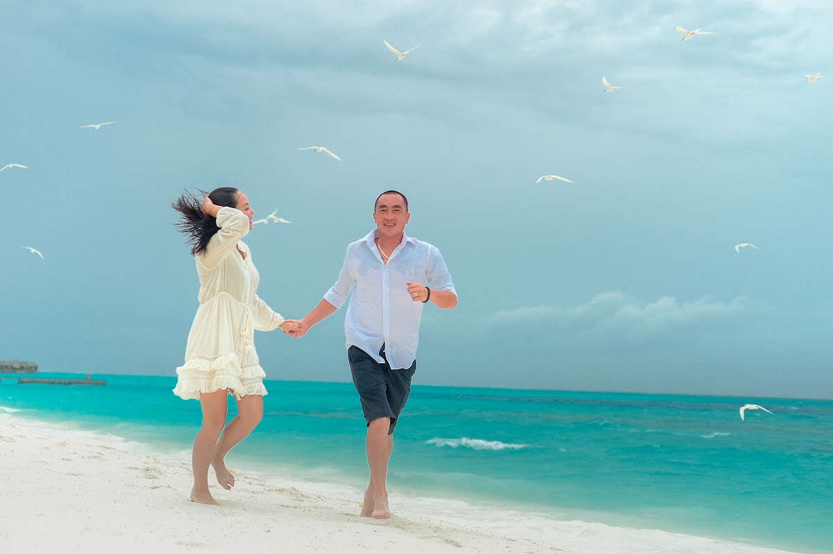 J & L Honeymoon Portrait at Conrad Maldives Rangali Island — frame 11